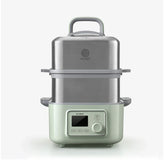 Multifunctional kitchen appliance with digital display on a white background